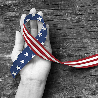 hand with flag ribbon